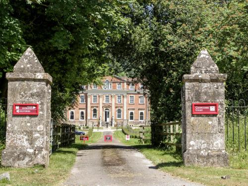 an entrance to a mansion with two stone gates at The Outlook in Taunton