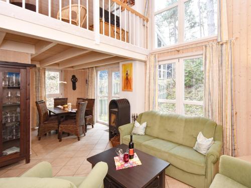 a living room with a couch and a table at Ferienhaus Ostseeblick 274 in Baabe