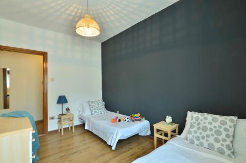 מיטה או מיטות בחדר ב-Casa Boller di TSS' - Tranquillo appartamento con Giardino e Gazebo & Paese Tranquillo - Ideale per Famiglie