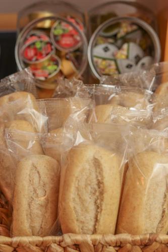 a bunch of sandwiches in plastic bags in a basket at La City Estación in Alicante