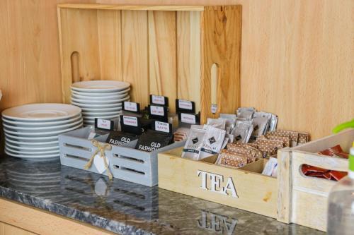 a counter top with boxes of dishes and plates at La City Estación in Alicante