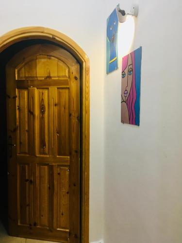 a door and a picture of a woman on a wall at Villa 22 in Dahab