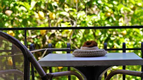 a teddy bear sitting on top of a table at Hotel Tourist in Parga