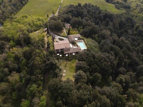 an aerial view of a house in the woods at La Melosa Resort & Spa in Roccastrada