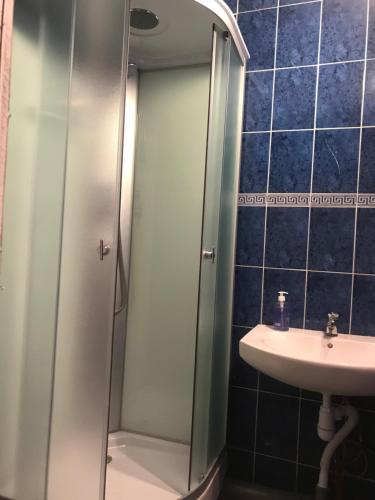 a bathroom with a shower and a sink at Kosher Hostel in Odesa