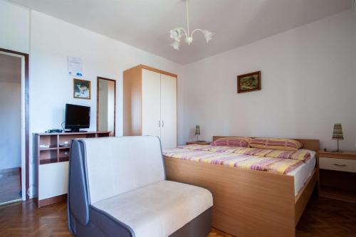 Postel nebo postele na pokoji v ubytování Apartments Dara