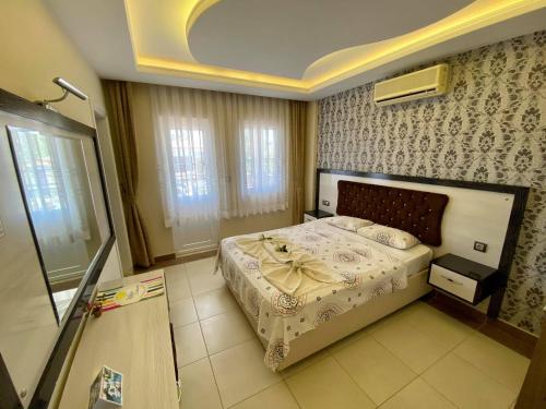En eller flere senge i et værelse på Yalcin Hotel & Villas