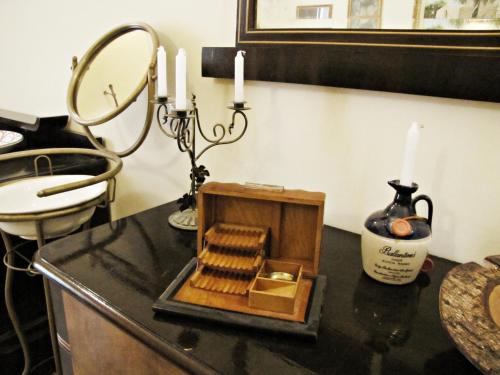 a table with candles and a box on a counter at B&B Dei Bottai in Gallipoli