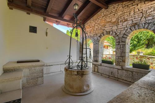 a room with a large barrel in the middle of a building at Holiday Home Kukurin in Bale