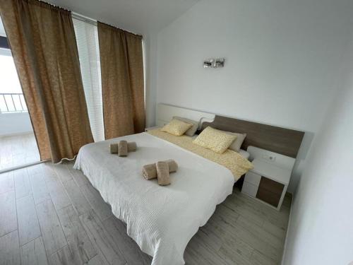 a bedroom with a bed with two pillows on it at Modern Apartment with sea view close to Marbella in Mijas