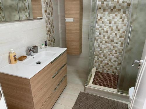 a bathroom with a sink and a shower at Modern Apartment with sea view close to Marbella in Mijas