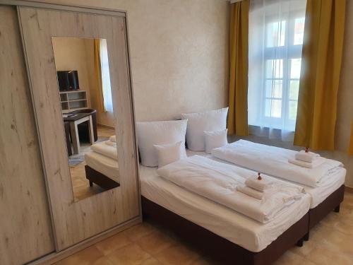 Ένα ή περισσότερα κρεβάτια σε δωμάτιο στο Apartments Oberschlesien