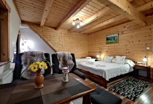 Postel nebo postele na pokoji v ubytování Magnat Inn Sauna & Relax