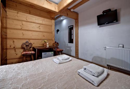 Postel nebo postele na pokoji v ubytování Magnat Inn Sauna & Relax