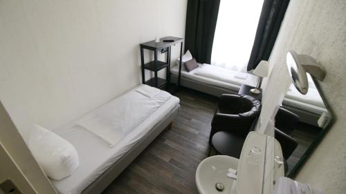 Ένα ή περισσότερα κρεβάτια σε δωμάτιο στο Hotel Bee Fang