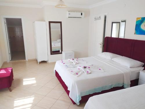 En eller flere senger på et rom på Bucak Apart Hotel Göcek & Beach