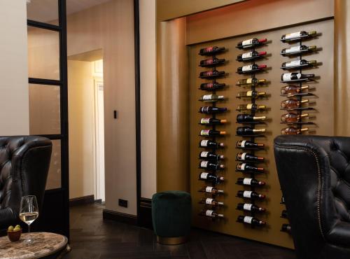 a wine cellar with a rack of wine bottles at Poorter Boutique Hotel Brielle in Brielle