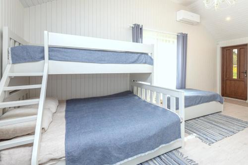 Postelja oz. postelje v sobi nastanitve Atostogu sala