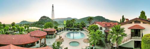 an aerial view of a resort with a swimming pool at Portakal Hotel Dalyan in Dalyan