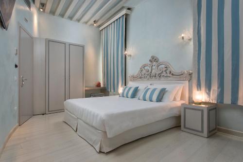Postel nebo postele na pokoji v ubytování Relais Venezia