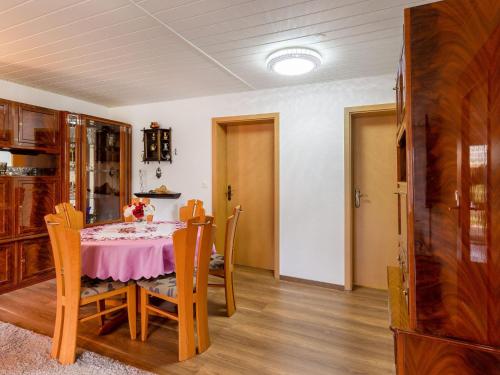a dining room with a table and chairs at Ruhige Gartenwohnung in Dresden in Dresden