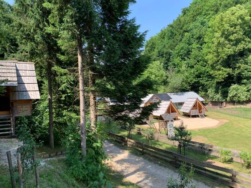 an aerial view of a group of tents in the woods at Wooden Cabin Kamna Gorica in Kamna Gorica