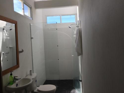 a bathroom with a shower and a toilet and a sink at Finca La Ranchera No. 2 in Tarso