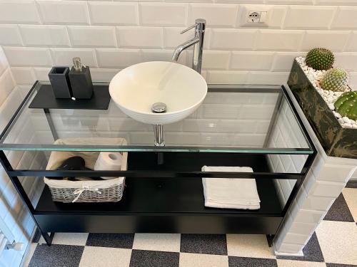 a glass table with a sink in a bathroom at HABITARE Lecce & Salento in Lecce