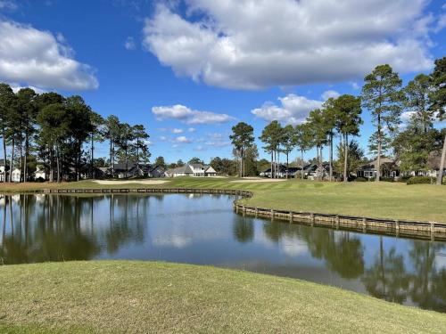 a view of a pond at a golf course at 503 villa in Calabash
