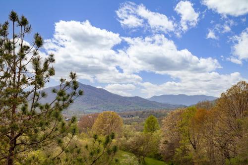 a view of a valley with trees and mountains at BareFoot Cabin cabin in Sevierville