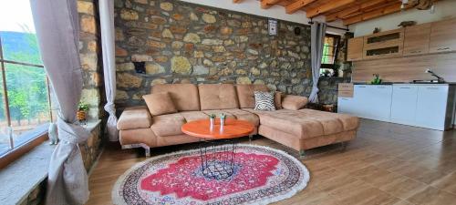 a living room with a couch and a table at Villa Eskici in Staro Myasto
