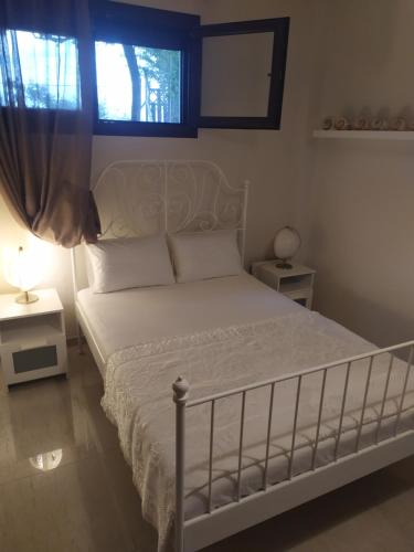 Postel nebo postele na pokoji v ubytování Afrodites sea view house