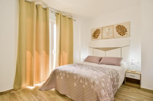 Voodi või voodid majutusasutuse Apartments CURA BEACH toas