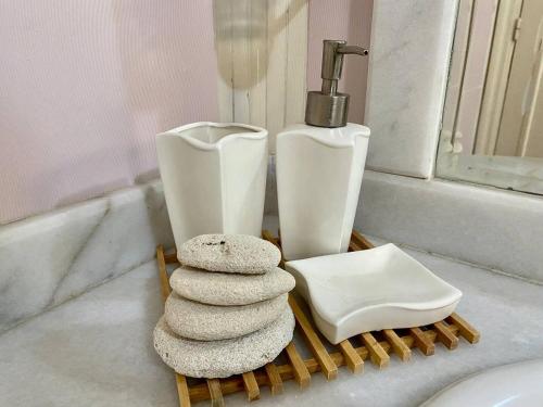 a pile of towels sitting on a bathroom counter at Chalet with backyard in North Coast near Marina & New Alamein الساحل الشمالي العلمين in El Alamein