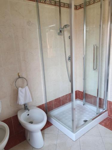a bathroom with a shower and a toilet at Villa Berghinz in Venice-Lido