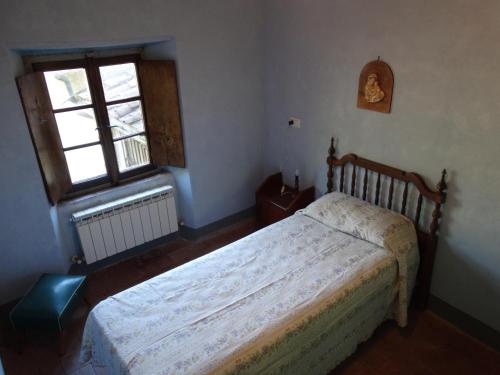 En eller flere senge i et værelse på CASA CARLINO