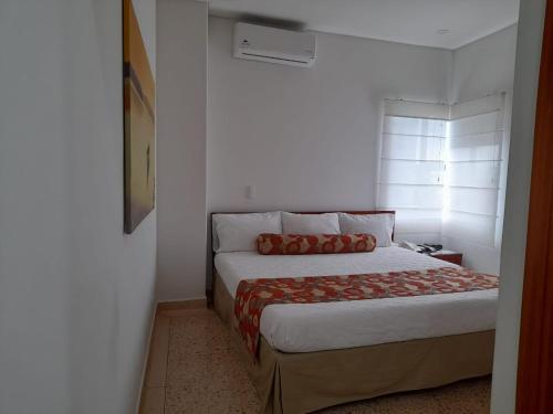 Postel nebo postele na pokoji v ubytování HOTEL OSCAR Tradición