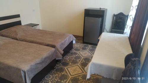 Una cama o camas en una habitación de Erazank Hotel