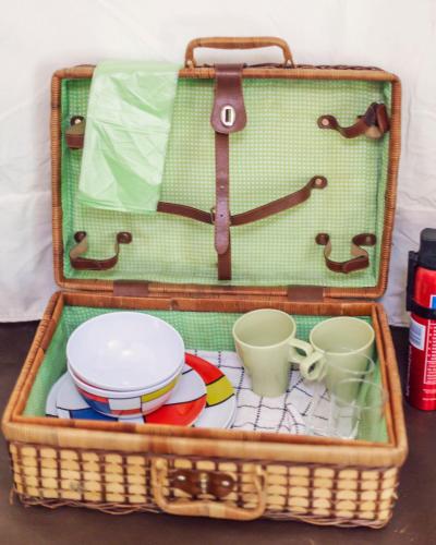 a suitcase filled with dishes and cups and plates at DGG Woodland Escape in South Barrow