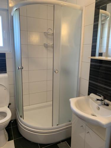 a bathroom with a shower and a sink at Apartmani Paula in Vodice