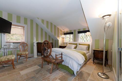 a bedroom with a bed and a table and chairs at House On Dunbar B&B in Vancouver