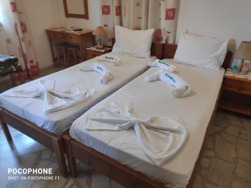 Postel nebo postele na pokoji v ubytování Katerina Apartments