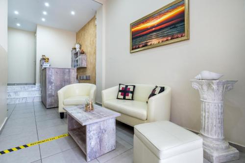 a living room with a couch and a table at Ioanna's House in Potos