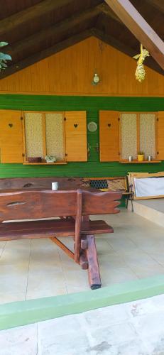 a wooden bench sitting inside of a building at Pod Modrzewiami in Milówka