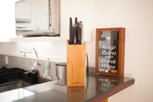 a knife block sitting on top of a kitchen counter at Geriba Beach apart hotel apt504 in Búzios