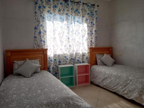 Voodi või voodid majutusasutuse Résidence Tafoult complexe Lunja village Agadir Imiouadar toas