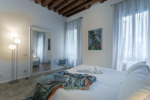 Postelja oz. postelje v sobi nastanitve Palazzo Venere Apartments