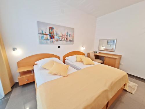 Ένα ή περισσότερα κρεβάτια σε δωμάτιο στο Hotel Sunce