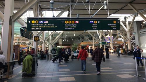 a group of people walking through a shopping mall at Richmond Vancouver Airport Comfy Home in Richmond