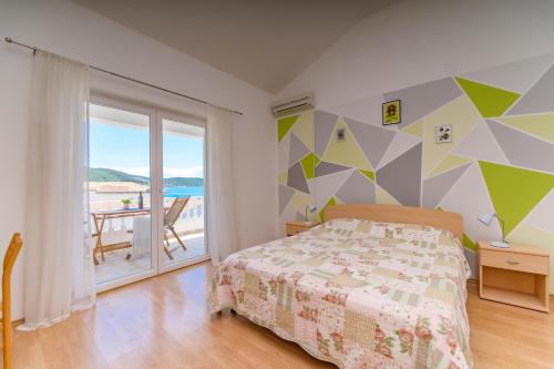 Postel nebo postele na pokoji v ubytování Apartmani Noris (app2)